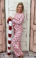 Slip into comfort with our Annie Pajamas, the perfect blend of cozy and cute. This two-piece set features a long sleeve scoop neck top and long pants with a 27” inseam. Designed with an elastic waistband, adjustable drawstring, and side pockets, these pajamas are made from a soft, stretchy blend of 94% polyester and 6% spandex—giving you that just-right feel for lounging or bedtime.