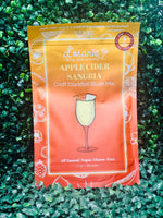 Fall apple cider sangria with white wine, apple cider, and water served over ice in a glass pitcher