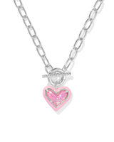Fall for the Ari Heart Silver Necklace in Pink Iridescent Glitter Glass! Featuring a heart charm, enamel frame, and trendy link chain with toggle closure, it’s convertible too!