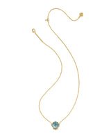 Kendra Scott Brynne Shell Gold Short Pendant Necklace with textured shell-shaped pendant and signature hoofprint detailing on a gold chain. Kendra Scott shell necklace, gold shell pendant necklace, coastal jewelry, beach-inspired necklace, layered gold necklace, women’s gold jewelry, summer jewelry staple, Sweet Southern Charm jewelry, Kendra Scott authorized retailer