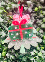 Festive acrylic Christmas claw clips in tree, gingerbread man, present, and snowman designs. Perfect for holiday hairstyles!