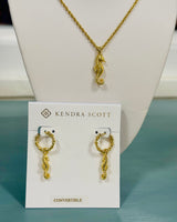 Kendra Scott gold seahorse short pendant necklace on delicate chain, seaside-inspired coastal jewelry
Kendra Scott gold seahorse huggie earrings.