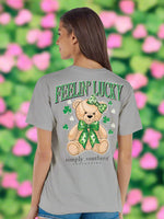 Lucky Teddy Tee
Simply Southern 
Feelin Lucky Tee
Features a Brown teddy bear with green bows. 
Printed on a grey tee