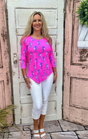 Lulu-B Asymmetrical Top in Seahorse Hot Pink with UPF 50 fabric, scoop neckline, 3/4 sleeves, and a stylish asymmetrical hemline. Comfortable & pre-shrunk.