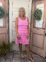 Feminine, flattering, and sun-safe! This best-selling sleeveless dress features charming ruffles on the front and back, a scoop neckline, and a straight hemline. Crafted from a soft 92% Nylon / 8% Spandex blend, it offers a comfortable, stretchy fit that flatters all shapes and sizes. With UPF50 sun protection and a 30.5" length, it’s perfect for sunny days, travel, or everyday wear. Pre-shrunk for a lasting fit—just machine wash and hang dry for easy care!