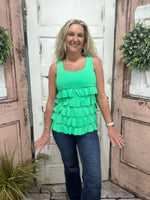 Flirty, fun & sun-safe! The Cha Cha Tank features ruffles, UPF50 protection, & a flattering fit—perfect for sunny days, travel, or everyday wear.
Features ruffle details and a Kelly Green color tank