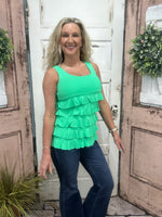 Flirty, fun & sun-safe! The Cha Cha Tank features ruffles, UPF50 protection, & a flattering fit—perfect for sunny days, travel, or everyday wear.
Features ruffle details and a Kelly Green color tank