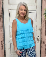 Turn heads with the flirty and fun Cha Cha Tank! Designed with soft, stretchy fabric and UPF50 protection, this feminine favorite features front and back ruffles, a scoop neckline, and a straight hemline at the waist. At 30.5" long, it pairs perfectly with any bottoms for effortless summer style. Machine washable and hang dry for easy care—add a little cha cha to your wardrobe today!