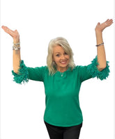 Elevate your everyday style with the Lulu-B FX Cashmere Scoop Neck Sweater Top. Luxuriously soft and lightweight, this must-have piece combines comfort with chic detail. The scoop neckline flatters every figure, while playful fringe on the elbow-length sleeves adds just the right touch of charm. Dress it up with slacks for work or pair with jeans for a polished casual look—you’ll love how effortlessly versatile it is.