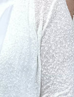 Stay stylish with this lightweight cardigan featuring a textured weave pattern. Perfect for summer, it offers great arm coverage without feeling too hot.