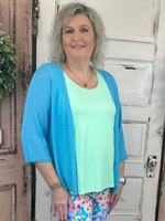 This cardigan features a beautiful weave pattern with textured fabric, adding a touch of summer to your wardrobe. The intricate design creates a unique and subtle look that you'll love.