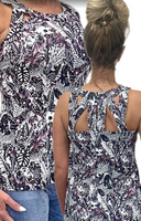 The Lulu-B Sexy Tank in the JTBW print features a striking black and white pattern with hints of hot pink and hidden animals woven throughout — a conversation-starting print that pairs beautifully with solid neutrals and lets your personality do the talking.
Cut out back detailing