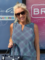 Sleek, stylish, and sun-smart — this Sleeveless Keyhole Top is made from a soft 92% Nylon and 8% Spandex blend for a comfortable stretch fit. It features a flattering V-neckline with a keyhole detail, a straight hemline, and a 23-inch center length. Pre-shrunk for consistent sizing and offering UPF 50 sun protection, it's perfect for warm-weather outings. Easy to care for—just machine wash and hang dry.