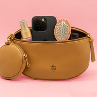 Made of PU leather, it features a detachable strap, detachable coin pouch, secure top zip closure, and an additional back zippered pocket. The spacious lined interior includes an extra zippered pocket for easy organization. Finished with the signature Simply Southern logo for a chic touch. 💕