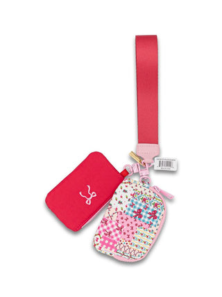 The little bag that does a lot. This Simply Southern ID Coin Wristlet keeps your essentials organized and close at hand — perfect for running errands, heading to a game, or anytime you want to travel light without sacrificing style.

Key Details | Two compact pouches: one solid, one patterned
Strap | Matching wrist strap included
Function | ID window and coin pouch in one convenient wristlet
Style | Available in Pink Quilted Ribbon, Orange Quilted Floral, and Navy Ribbon Floral
Brand | Simply Southern