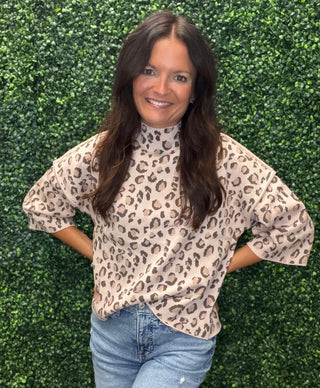 Print | Light pink background with pink and brown leopard pattern
Neckline | Mock neck
Sleeve | 3/4 length
Length | Hip-length; easy to tuck or wear out
Fabric | Lightweight sweater knit; soft and comfortable
3/4 Sleeve Mock Neck Leopard Sweater