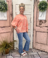 Coral Textured Top With Floral Detail
