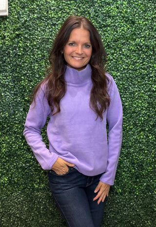 Neckline | High neck
Sleeve | Long sleeve
Fabric | 65% polyester, 31% spandex knit
Stretch | Excellent stretch with great recovery
Care | Check garment label for care instructions
Color | Lilac