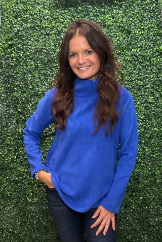 Neckline | High neck
Sleeve | Long sleeve
Fabric | 65% polyester, 31% spandex knit
Stretch | Excellent stretch with great recovery
Care | Check garment label for care instructions
Color | Royal Blue