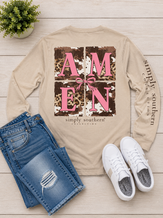 Brand | Simply Southern
Style | Long Sleeve Graphic Tee
Graphic | Bold pink "AMEN" lettering on leopard and cowhide print grid with pink bow detail
Sleeve Detail | "Simply Southern Collection" printed down the left sleeve
Color | Sand (Cream)
Neckline | Crew neck
Sleeve | Long sleeve
Fabric | 100% Cotton — soft, breathable, and easy to care for
Care | Machine wash cold, tumble dry low