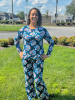 Slip into comfort with our Annie Pajamas, the perfect blend of cozy and cute. This two-piece set features a long sleeve scoop neck&nbsp;top and long pants with a 27” inseam. Designed with an elastic waistband, adjustable drawstring, and side pockets, these pajamas are made from a soft, stretchy blend of 94% polyester and 6% spandex—giving you that just-right feel for lounging or bedtime.
