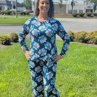 Slip into comfort with our Annie Pajamas, the perfect blend of cozy and cute. This two-piece set features a long sleeve scoop neck&nbsp;top and long pants with a 27” inseam. Designed with an elastic waistband, adjustable drawstring, and side pockets, these pajamas are made from a soft, stretchy blend of 94% polyester and 6% spandex—giving you that just-right feel for lounging or bedtime.