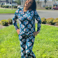 Slip into comfort with our Annie Pajamas, the perfect blend of cozy and cute. This two-piece set features a long sleeve scoop neck&nbsp;top and long pants with a 27” inseam. Designed with an elastic waistband, adjustable drawstring, and side pockets, these pajamas are made from a soft, stretchy blend of 94% polyester and 6% spandex—giving you that just-right feel for lounging or bedtime.