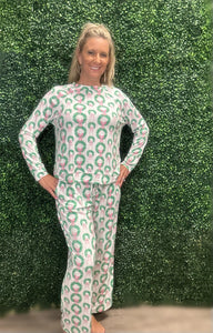Slip into comfort with our Annie Pajamas, the perfect blend of cozy and cute. This two-piece set features a long sleeve scoop neck&nbsp;top and long pants with a 27” inseam. Designed with an elastic waistband, adjustable drawstring, and side pockets, these pajamas are made from a soft, stretchy blend of 94% polyester and 6% spandex—giving you that just-right feel for lounging or bedtime.