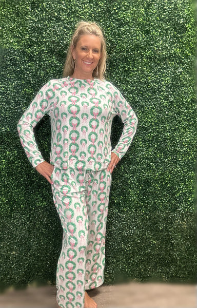 Slip into comfort with our Annie Pajamas, the perfect blend of cozy and cute. This two-piece set features a long sleeve scoop neck top and long pants with a 27” inseam. Designed with an elastic waistband, adjustable drawstring, and side pockets, these pajamas are made from a soft, stretchy blend of 94% polyester and 6% spandex—giving you that just-right feel for lounging or bedtime.