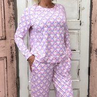 Slip into comfort with our Annie Pajamas, the perfect blend of cozy and cute. This two-piece set features a long sleeve scoop neck&nbsp;top and long pants with a 27” inseam. Designed with an elastic waistband, adjustable drawstring, and side pockets, these pajamas are made from a soft, stretchy blend of 94% polyester and 6% spandex—giving you that just-right feel for lounging or bedtime.