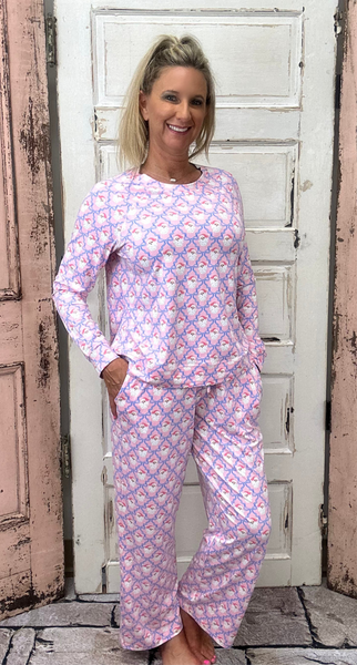 Slip into comfort with our Annie Pajamas, the perfect blend of cozy and cute. This two-piece set features a long sleeve scoop neck top and long pants with a 27” inseam. Designed with an elastic waistband, adjustable drawstring, and side pockets, these pajamas are made from a soft, stretchy blend of 94% polyester and 6% spandex—giving you that just-right feel for lounging or bedtime.