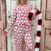 Slip into comfort with our Annie Pajamas, the perfect blend of cozy and cute. This two-piece set features a long sleeve scoop neck&nbsp;top and long pants with a 27” inseam. Designed with an elastic waistband, adjustable drawstring, and side pockets, these pajamas are made from a soft, stretchy blend of 94% polyester and 6% spandex—giving you that just-right feel for lounging or bedtime.
