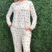 Slip into comfort with our Annie Pajamas, the perfect blend of cozy and cute. This two-piece set features a long sleeve scoop neck&nbsp;top and long pants with a 27” inseam. Designed with an elastic waistband, adjustable drawstring, and side pockets, these pajamas are made from a soft, stretchy blend of 94% polyester and 6% spandex—giving you that just-right feel for lounging or bedtime.