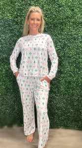 Slip into comfort with our Annie Pajamas, the perfect blend of cozy and cute. This two-piece set features a long sleeve scoop neck&nbsp;top and long pants with a 27” inseam. Designed with an elastic waistband, adjustable drawstring, and side pockets, these pajamas are made from a soft, stretchy blend of 94% polyester and 6% spandex—giving you that just-right feel for lounging or bedtime.