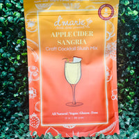 Fall apple cider sangria with white wine, apple cider, and water served over ice in a glass pitcher