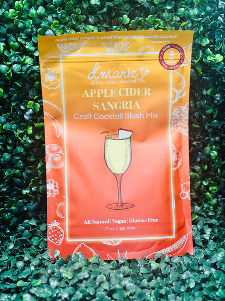 Fall apple cider sangria with white wine, apple cider, and water served over ice in a glass pitcher