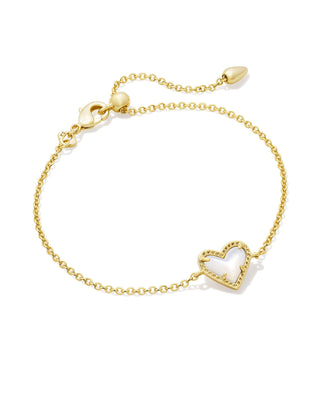 Design | Asymmetrical heart pendant on a delicate chain
Colorway | Gold in Ivory Mother of Pearl
Material | Ivory Mother of Pearl
Pendant | 0.56 inches long x 0.37 inches wide
Brand | Kendra Scott