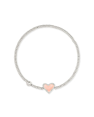 Brand | Kendra Scott
Metal | Rhodium over brass
Stone | Rose Quartz
Design | Heart detail with stretch construction
Size | 6.5-inch unstretched circumference; stations measure 1 inch long by 0.11 inch wide
Care | To help protect the finish, avoid water, perfume, and lotions; gently wipe with a soft cloth after wear.