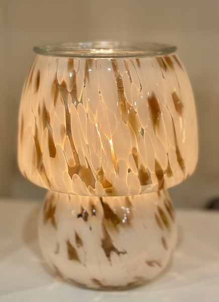 Stylish midcentury-inspired glass wax warmer with vintage bulb and soft amber glow. A flame-free, elegant way to fill your home with fragrance.