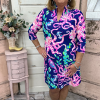 Make waves in the Arlene Quarter Sleeve Dress - Get Kraken (Navy)! With a flattering V-neck, shift style, and side pockets, this comfy dress is perfect for any occasion.