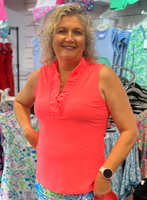 True to size with a flattering, relaxed fit. The ruffle V-neckline adds feminine detail without bulk, and the Nylon-Spandex blend offers a smooth, comfortable stretch. Quick-drying and wrinkle-free — ideal for packing.

Bright Salmon Color Tank with Ruffle V-Neck Detail.
