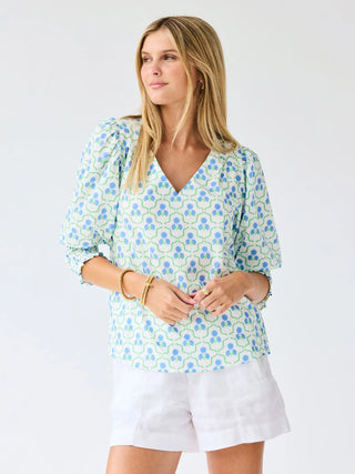 The Ashlyn Top is an easy staple with thoughtful detail. Featuring a flattering V-neckline, smocked cuff sleeves, and a straight fit, it’s comfortable and effortless. Pair it with your favorite jeans or shorts for a go-to look you’ll reach for again and again.