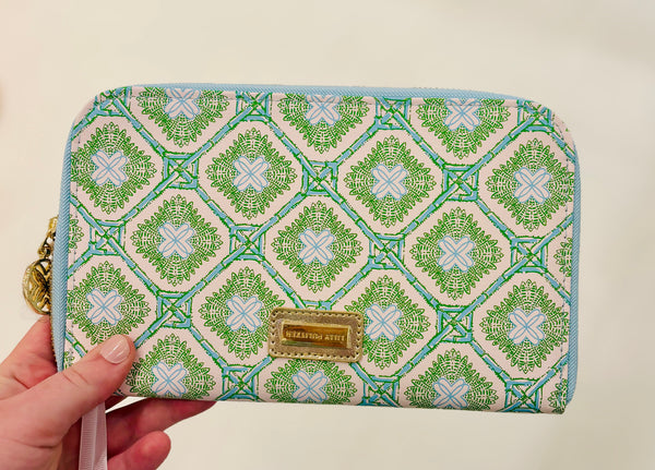 Lilly Pulitzer zipper wallet, Bamboo Logo Trellis wallet, travel organizer wallet, passport wallet, Lilly Pulitzer travel accessories, zipper wallet with pockets, stylish travel wallet. Lilly Pulitzer Bamboo Logo Trellis zipper wallet with gold logo plaque and bamboo zipper pull, designed for travel essentials