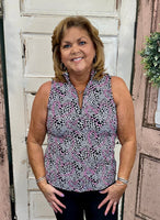 Beachtime sleeveless 1/4 zip tank with SPF sun protection, lightweight breathable fabric, quarter-zip neckline, travel-friendly warm weather top for walking, resort wear, and everyday comfort.
