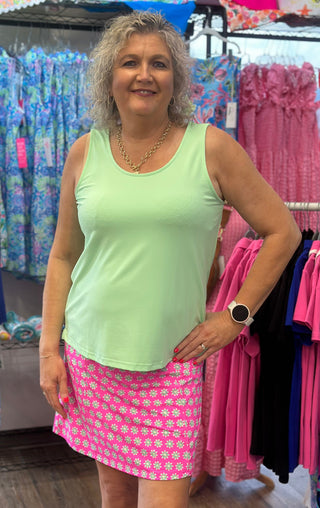 Hot Pink Skort with white flowers printed on it with lime green flower centers. Designed with a flattering, easy-to-wear fit that works across a range of body types. If you’re between sizes, size up for a more relaxed feel. The built-in shorts underneath provide comfortable coverage and stay in place all day.