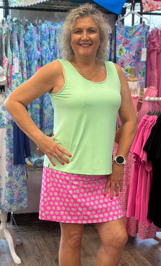 Hot Pink Skort with white flowers printed on it with lime green flower centers. Designed with a flattering, easy-to-wear fit that works across a range of body types. If you’re between sizes, size up for a more relaxed feel. The built-in shorts underneath provide comfortable coverage and stay in place all day.