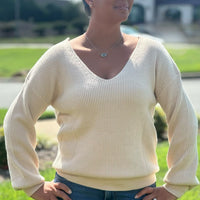 Chic, cozy, and on-trend — this Bow Sweater is a must-have for the season! Featuring adorable bow accents, this stylish piece easily transitions from casual to dressy. Whether you're pairing it with your favorite jeans for a laid-back look or dressing it up with tailored pants and boots, this sweater adds a feminine touch to any outfit. Soft, comfortable, and effortlessly cute — it’s sure to become a go-to in your wardrobe.