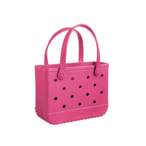 Add a pop of color with the Bogg Bag Watermelon Shimmer! This stylish, durable, & waterproof tote is perfect for beach days, poolside fun, & everyday adventures