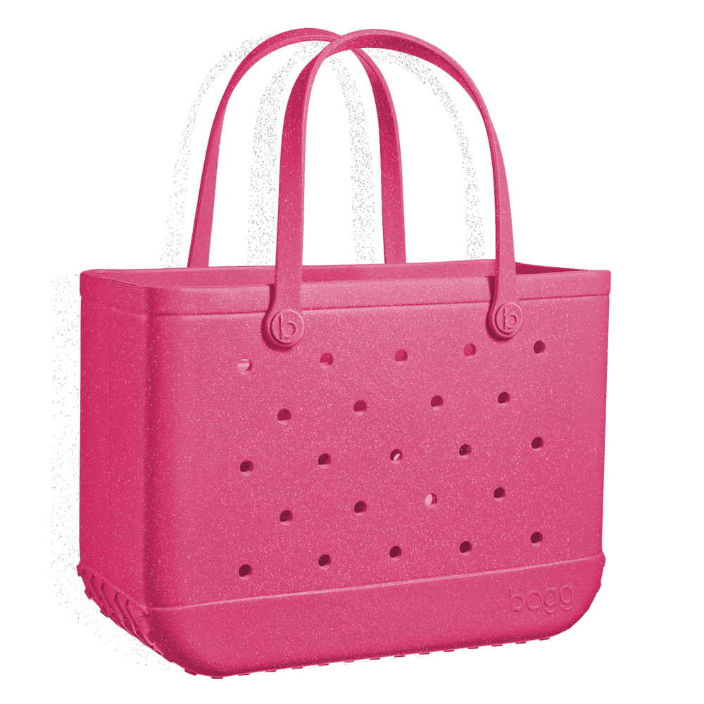 Add a pop of color with the Bogg Bag Watermelon Shimmer! This stylish, durable, & waterproof tote is perfect for beach days, poolside fun, & everyday adventures