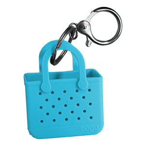 Bogg, but make it mini. We shrunk our iconic tote—down to the buttons and tread bottom and created the cutest keychain ever. The charming accessory can be clipped to zipper pulls, keyrings and more. Perfect for adding an extra dose of fun to your everyday. Collect them all!